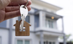 Landlord unlocks the house key for new home.  Real Estate Agents, Sales Agents concept.